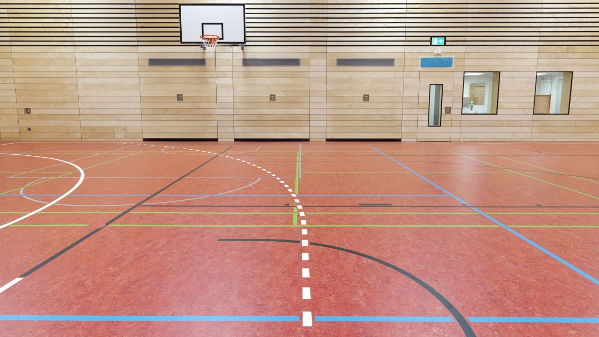 Sporthalle der Bischöflichen Canisiusschule Ahaus Nahaufnahme Bodenmarkierung in Sporthalle – Forbo Marmoleum Sport